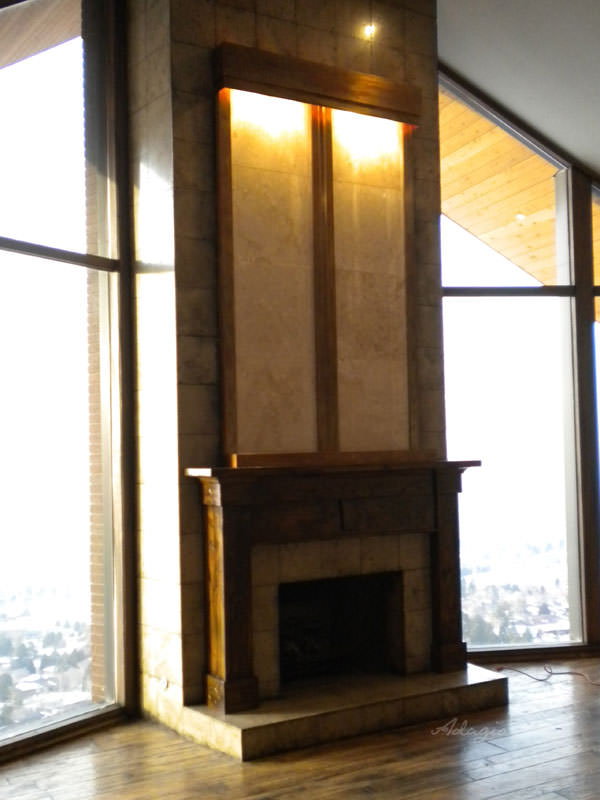 Large custom water feature above hearth